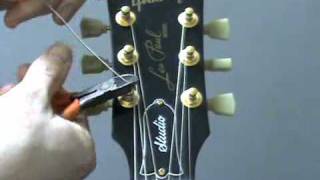 How to re string a guitar [upl. by Ahsitruc]