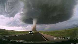 Storm chasing dashcam Tornado crossing the highway Laramie Wyoming [upl. by Ignatzia487]