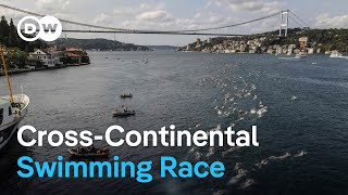 Thousands swim between continents in iconic Istanbul race  DW News [upl. by Ynnohj]