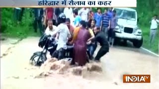 Video People Form Human Chain to Save Biker Stuck in Flood in Uttarakhand [upl. by Norreht]