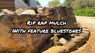 Rip rap mulch with feature bluestones [upl. by Aissila]