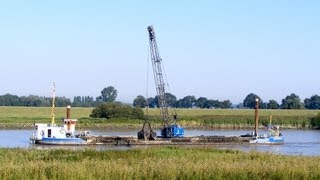 Baggerschiff quotLemsterlandquot auf der Ems  Dredger quotLemsterlandquot on the river Ems [upl. by Jankell]