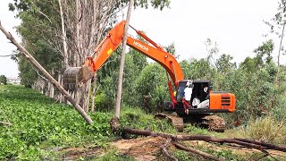 Excavator working best Hitachi zaxis 210LC ditch and tree clearing [upl. by Asilehs]