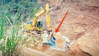 Severe rockfall  Komatsu pc 200 excavator clears rock and soil  Construction machine [upl. by Emiline375]