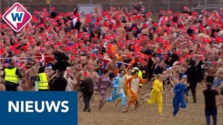 Nieuwjaarsduik 2019 Duizenden rennen naar de zee  OMROEP WEST [upl. by Chad]