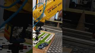 FANUC LR Mate 200iD Robot Pushing cars May 2024 [upl. by Nairbo24]