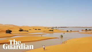 Drone footage shows rare flooding in the Sahara desert [upl. by Natica]