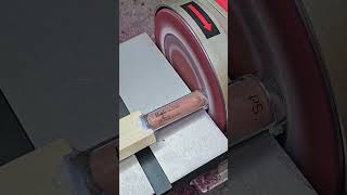 Person is destroying a tube of lip gloss with a sander [upl. by Kippar]