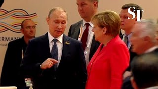 Angela Merkel gives Vladimir Putin epic eye roll [upl. by Anidem181]