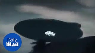 Bizarre footage from Malaysia shows giant UFO hovering  Daily Mail [upl. by Horace122]