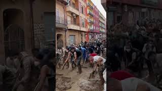 Volunteers sweep water after DEADLY Spain floods [upl. by Ahseele]