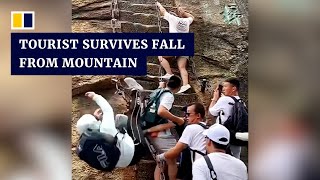 Chinese tourist survives fall from steep mountain steps [upl. by Chor230]