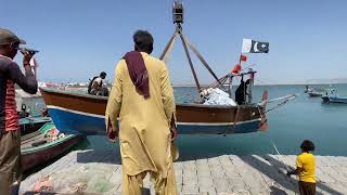 A view of the boat being lowered into the sea by a Crane in gwadar JT [upl. by Heid345]