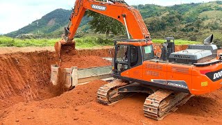 Big Excavator Doosan DX300 Loading Trucks  Mining Soil [upl. by Yonit3]