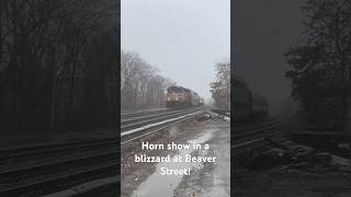 GP40MC 1124 rolls past beaver street during a blizzard while giving a horn show [upl. by Anyg139]