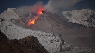 Shiveluch volcano lava dome at night Glowing rockfalls descend flanks of growing dome [upl. by Chamberlin]