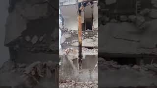 Building demolition Excavator demolishing house [upl. by Sheeree]