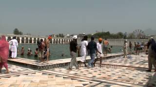 Pilgrims taking a dip in the holy sarovar at Anandpur Sahib [upl. by Suivat97]