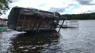 Straight Line wind flips pontoon in lift Pontoon and lift recovery [upl. by Suoirred]