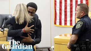 Botham Jeans brother hugs exofficer Amber Guyger after sentencing [upl. by Bernadene56]