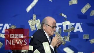 Moment Sepp Blatter was showered with fake dollar bills  BBC News [upl. by Nerraf638]