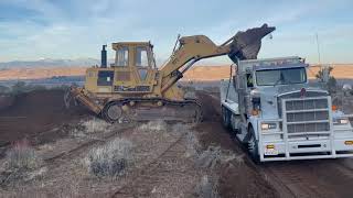 4G  CAT 973 Track Loader Operator Loading Super 10 Dump Truck [upl. by Chantalle]