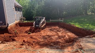 Excavating a foundation with bobcats [upl. by Ydisahc]