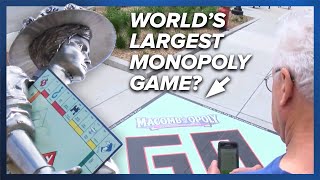 “Macombopoly” dubbed the world’s largest Monopoly board debuts in Illinois [upl. by Ide]