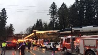 Amtrak train derails on highway in Washington state [upl. by Sivrahc764]