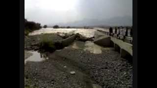 Oman  rare video of wadi flood water crossing the road [upl. by Rucker838]