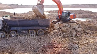 Stonework of excavator cat Hitachi 350 and dump truck [upl. by Derina194]