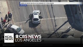 Robbery pursuit suspect crashes into another vehicle at a South Los Angeles intersection flees on f [upl. by Hermine360]