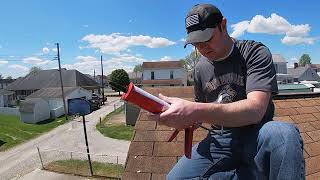 How to seal down a wind damaged roof shingle [upl. by Cecelia]