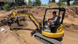 Augering holes for a greenhouse in Divide Colorado mountainliving greenhouse selfsufficient diy [upl. by Atteuqnas51]