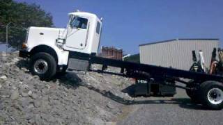 Peterbilt 357 6x6 Allwheel drive climbing rip rap rock bank [upl. by Blanka]