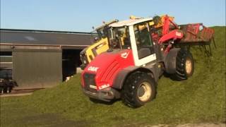 Komatsu 320A and OampK L20 5 on the silage clamp [upl. by Orbadiah411]