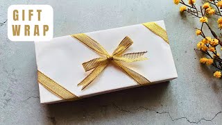 Easy Way to Wrap a Ribbon on a Christmas Gift Box  How to Wrap a Gift with Ribbon Easy christmas [upl. by Einhpad328]