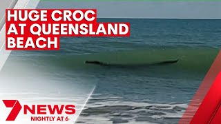 Crocodile spotted swimming at Central Queensland beach  7NEWS [upl. by Gee821]