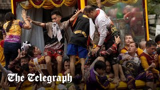 Millions of Filipinos swarm statue of Jesus for Black Nazarene procession [upl. by Barnard]