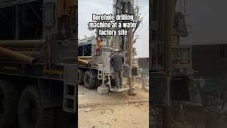 Drilling for water with borehole drilling machine at a new water factory site in Abuja [upl. by Lovering]