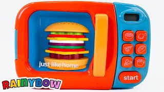 Making a Burger with Pretend Play in our Toy Kitchen [upl. by Erv]