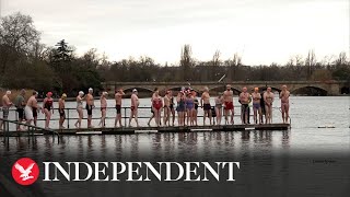 Swimmers compete in Christmas Day race at Londons Hyde Park [upl. by Gerome]