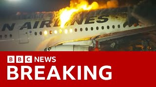 Japan Airlines plane in flames on the runway at Tokyos Haneda Airport BBC News [upl. by Aitercul336]