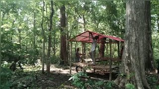 tying tarpaulin to shelter pole to protect it from the sun and rain in the middle of the wilderness [upl. by Kind269]