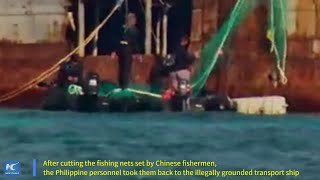 Philippine navy personnel on illegally grounded ship destroy Chinese fishing nets [upl. by Alket173]