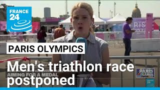 Mens Olympic triathlon race postponed over Seine pollution levels • FRANCE 24 English [upl. by Edals137]