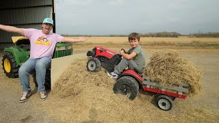 Playing with tractors moving hay and rocks  Tractors for kids [upl. by Neerahs]