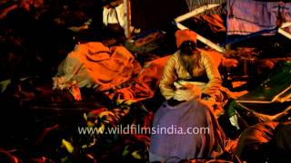 Pilgrims at Gangasagar mela relaxing as night falls [upl. by Melosa]