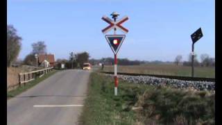 A Danish IC3 train passes railroad crossing nearby Radbjerg [upl. by Ariaek]