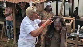 This herbalist woman is shaving and barbing mad people hair [upl. by Yditsahc]